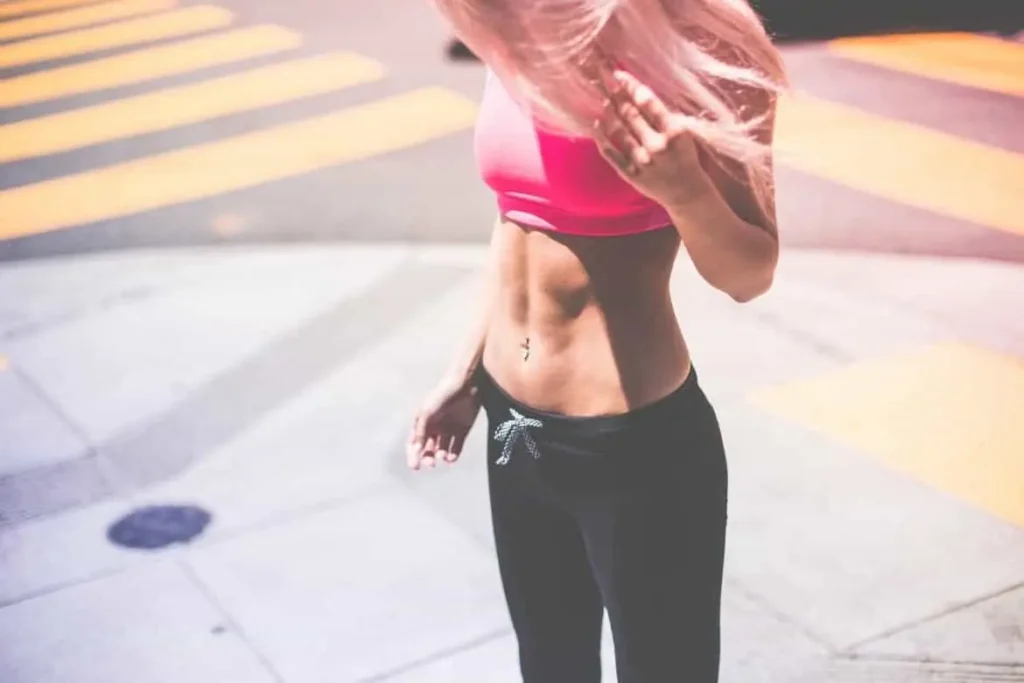 Woman with toned stomach after LA-EMS Body Sculpting Treatment Northwood Hills